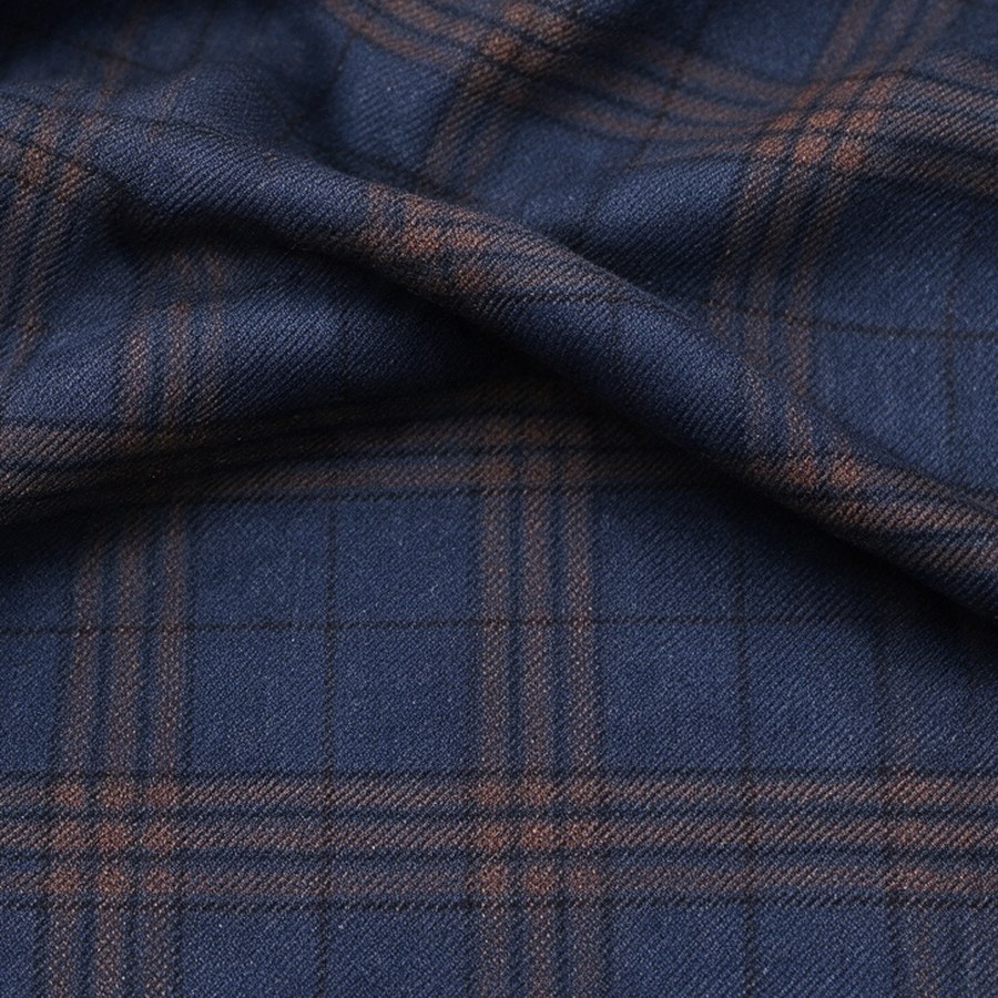 Navy wool swatch with a rust and brown plaid
